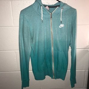 Nike turquoise zip-up jacket.